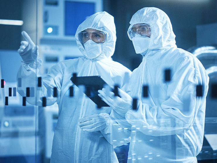 Two employees reviewing their work