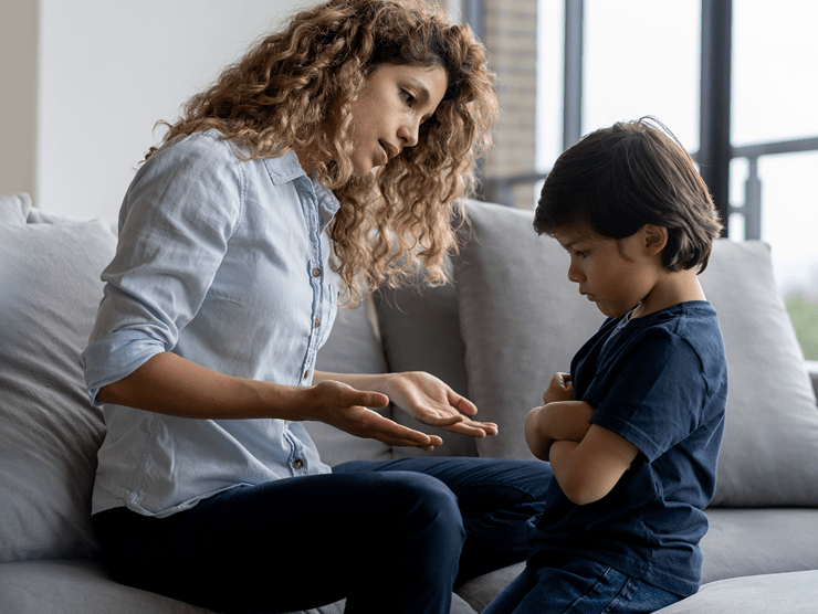 A mother talking to her child about their behavior