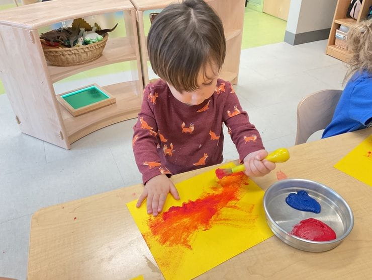 Children painting in a classroom