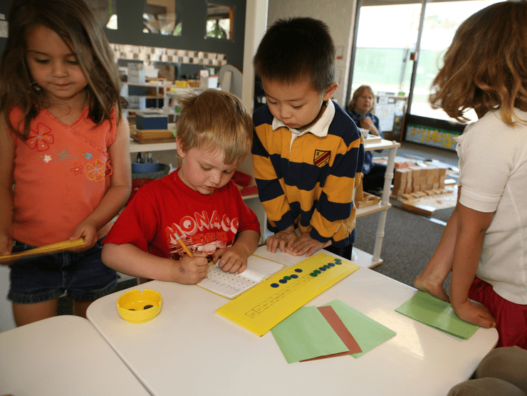 Kindergarteners playing games in a classroom