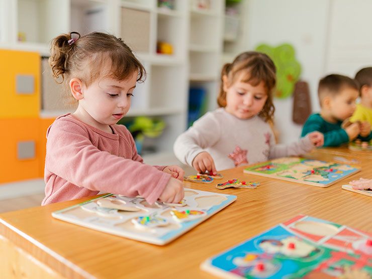 Young children working on arts and crafts