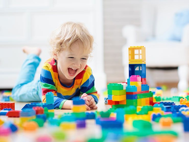 Small boy playing with legos