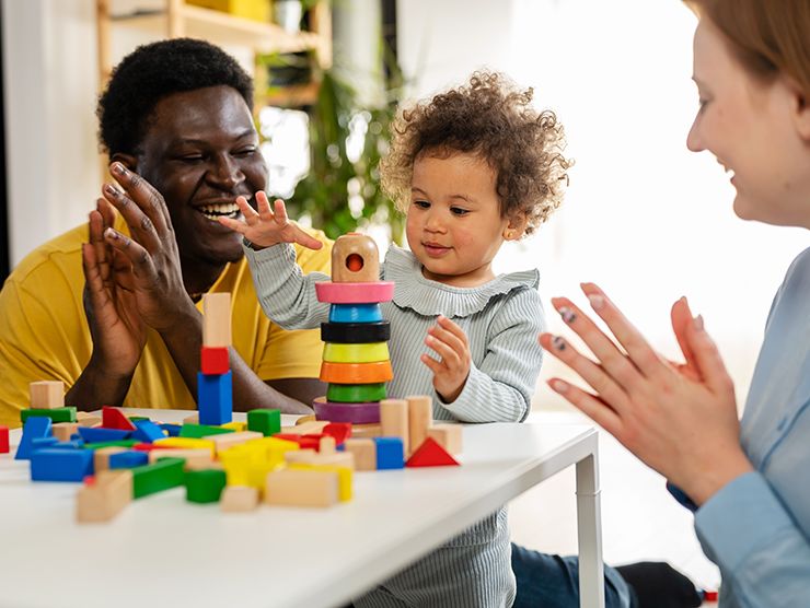 Family playing with building blocks
