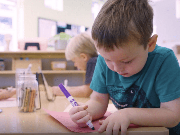 Children drawing in a classroom