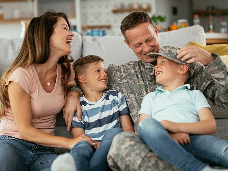 Military family spending time together on the couch