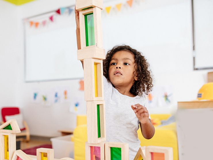 Young girl playing with blocks