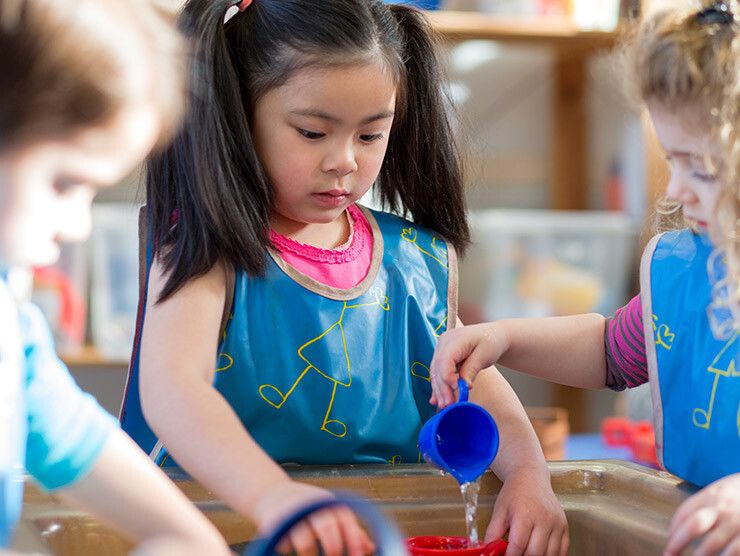 Pre-kindergarteners participating in a water activity
