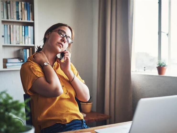 Woman on the phone at her desk
