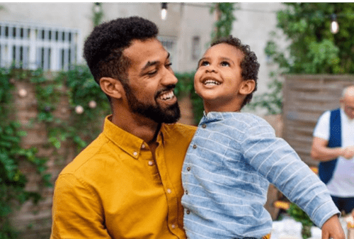 A father holding his son