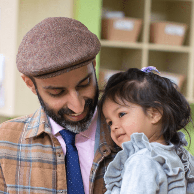 Parent and child sharing a close, supportive moment that reflects strong relationships and social-emotional development in the preschool years 