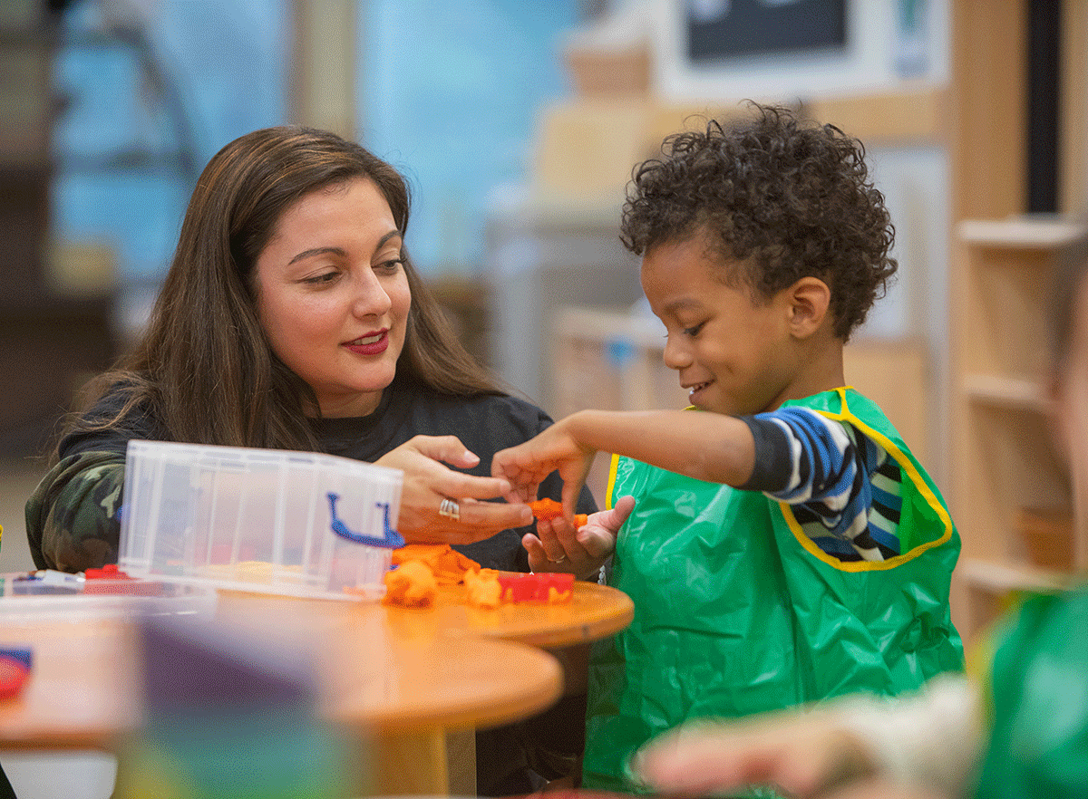 Teacher and student playing in the classroom