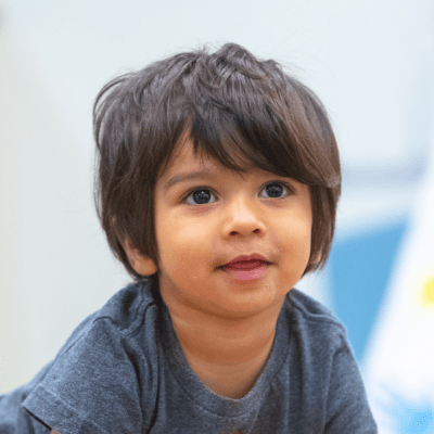 Toddler in daycare classroom building comfort and confidence during transition into toddler care 