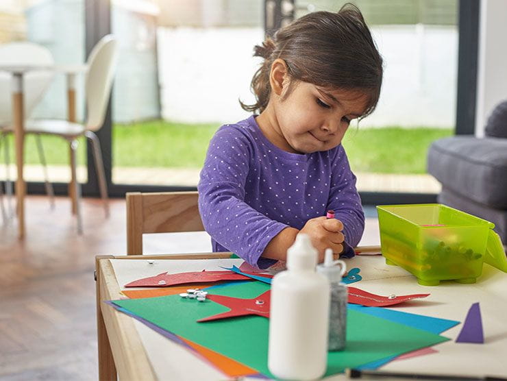 Young girl working on arts and crafts
