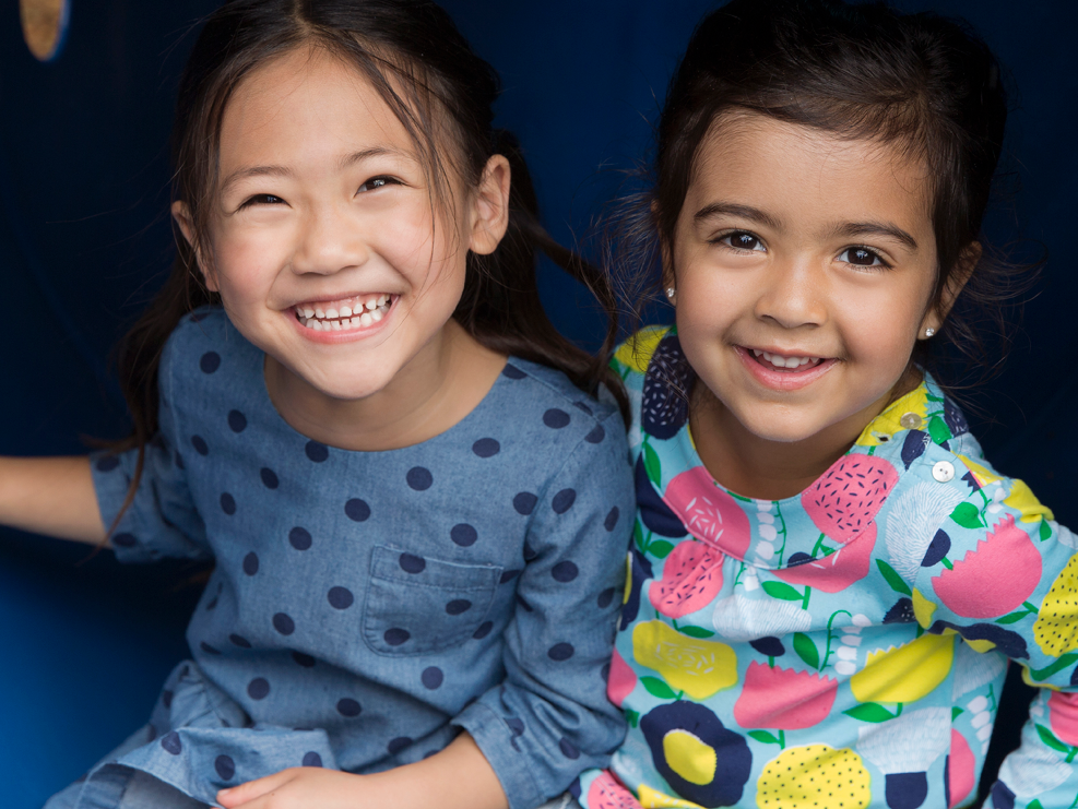 Two children smiling