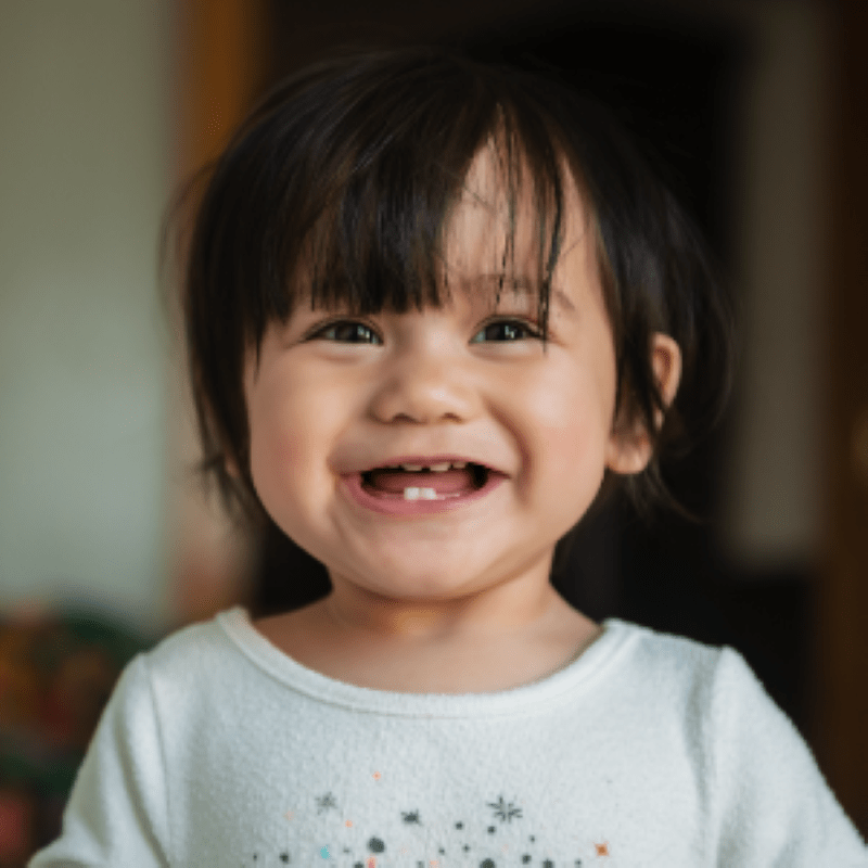 A girl toddler smiling. 