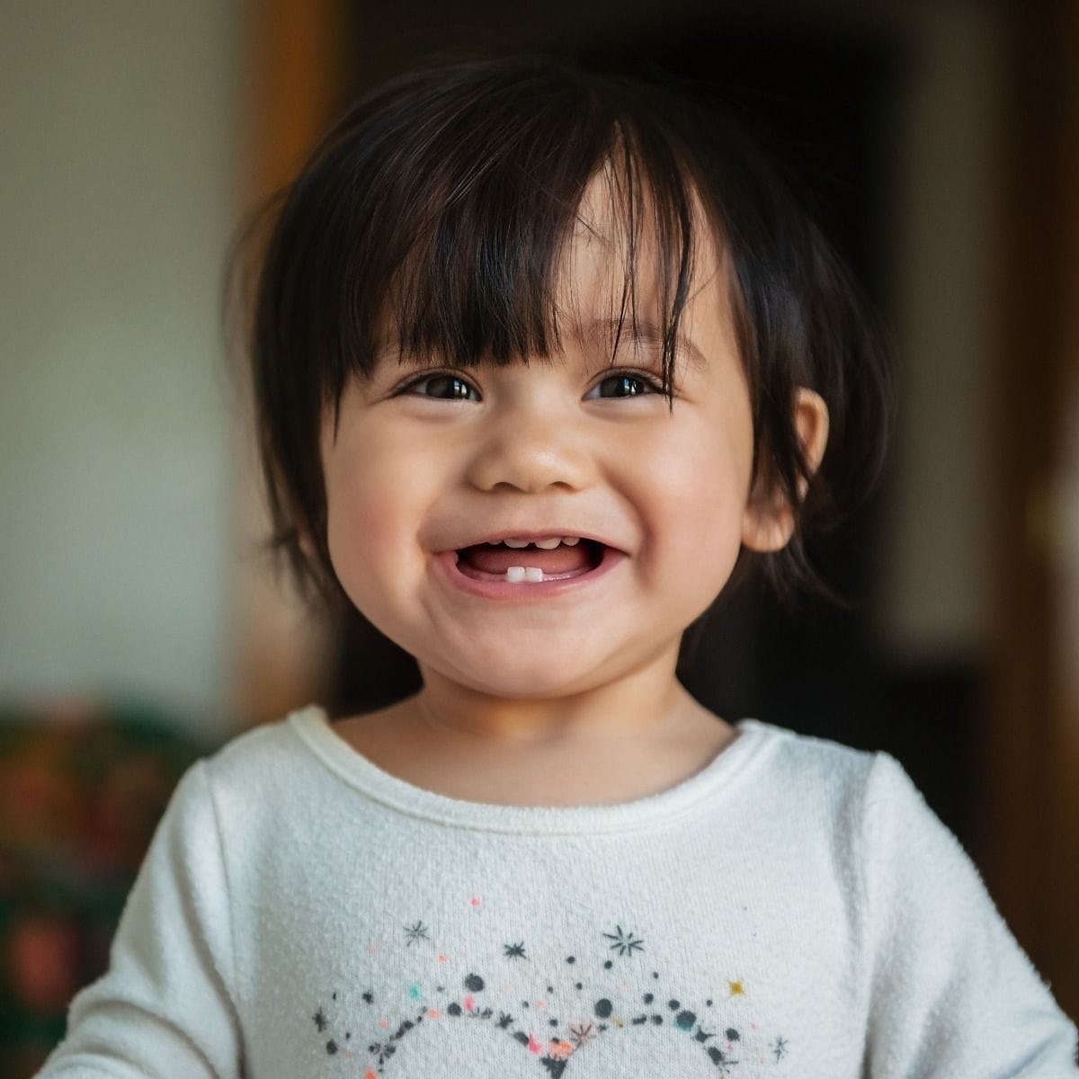 A girl toddler smiling. 