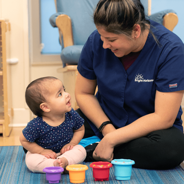 Child and teacher in Bright Horizons center