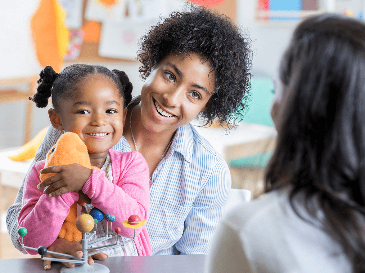Teacher with parent and child