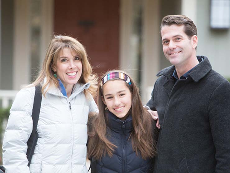 family outside for a fun holiday tradition