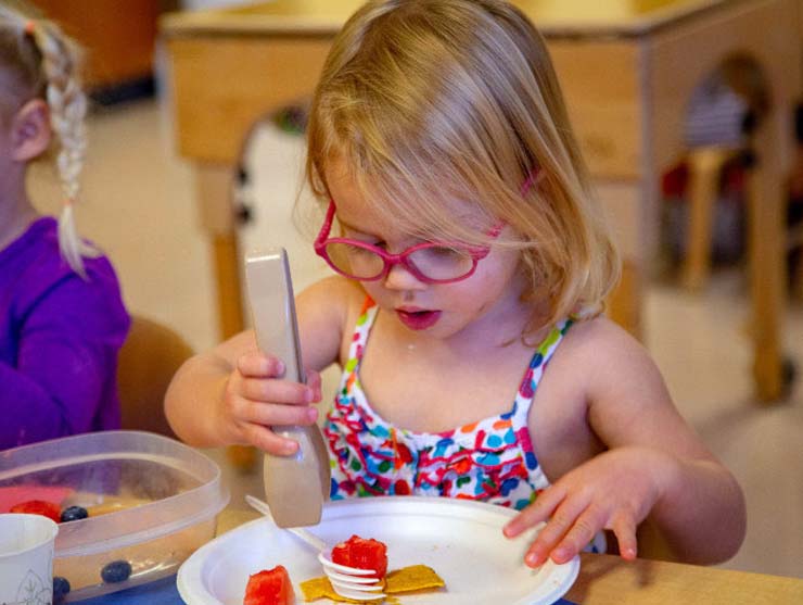preschool girl doing a math activity at home