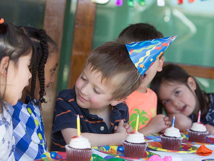 siblings attending preschool birthday party