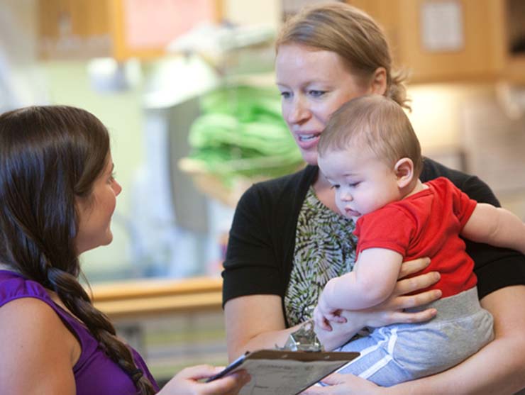 mom dropping off a baby daycare near me