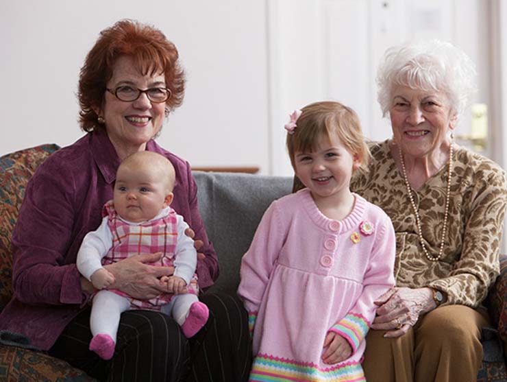 baby and toddler bonding with grandparents at home