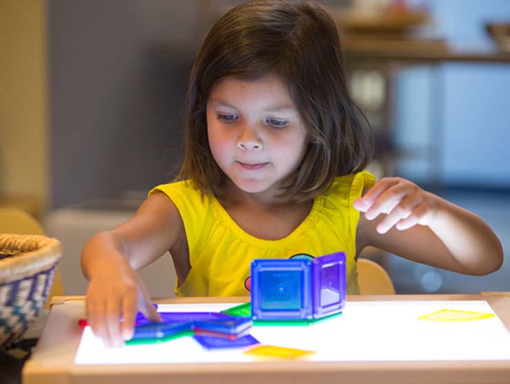pre-kindergarten girl learning stem at school