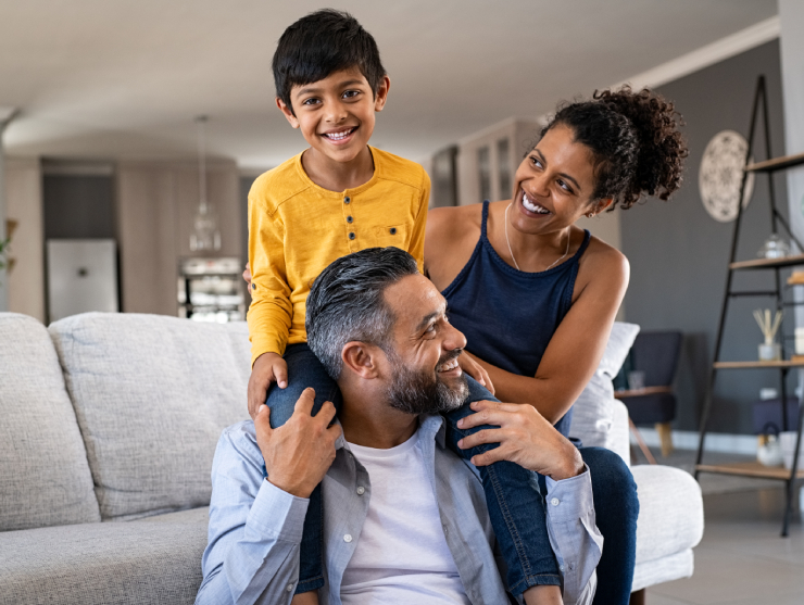 AAPI family at home on the couch together