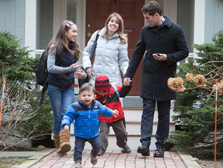 family leaving the house for a group activity
