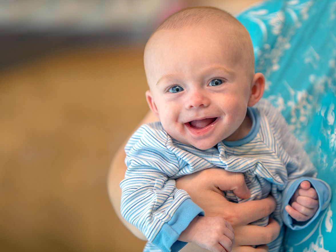 Happy baby getting individualized care for babies in the infant program at Bright Horizons