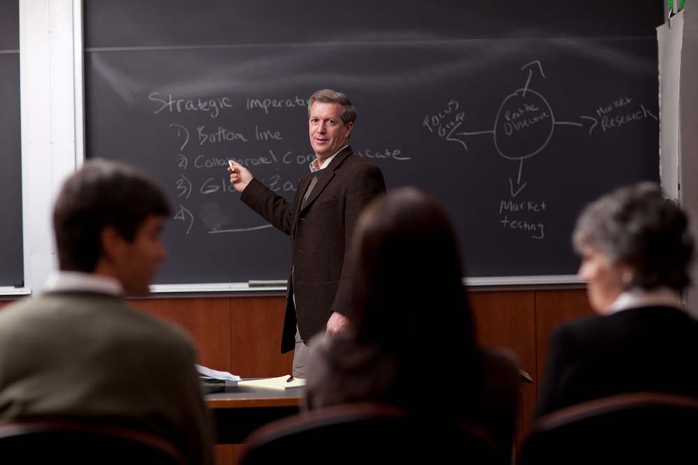 Teacher engaging with students in a classroom setting