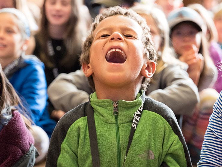 A boy screaming out of excitement.