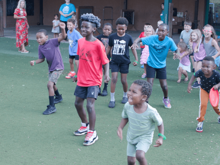 Kids running on grass. 