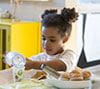 Preschooler pouring milk