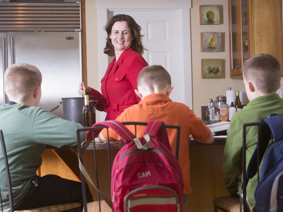 A mother and her three children at the breakfast table