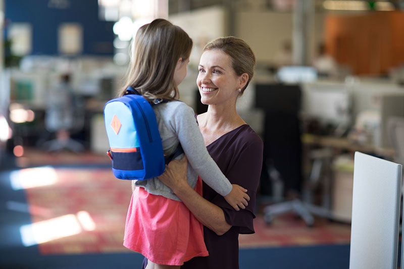 Working mom bringing her daughter to work with her