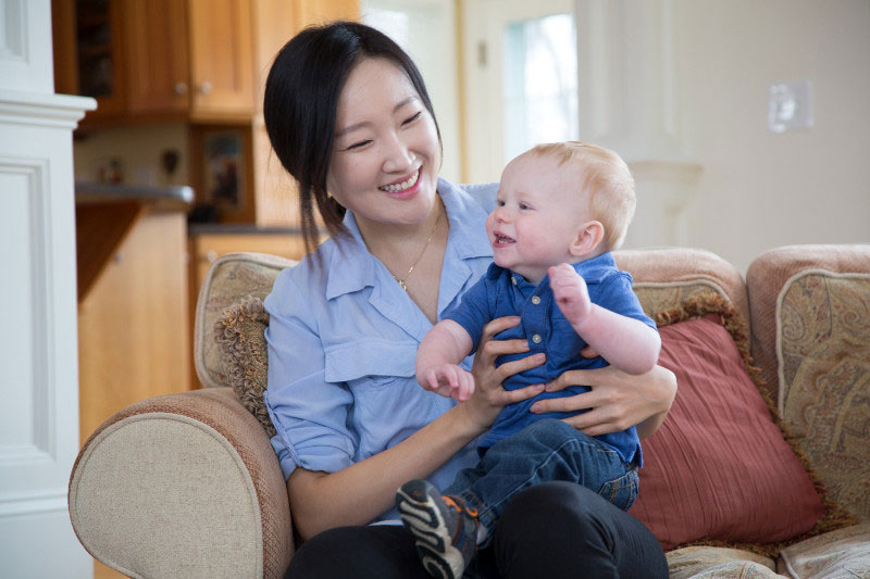 In-home back-up care provider taking care of an infant