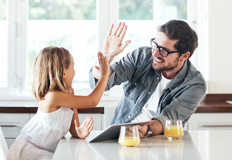 Dad trying to work while caring for his daughter