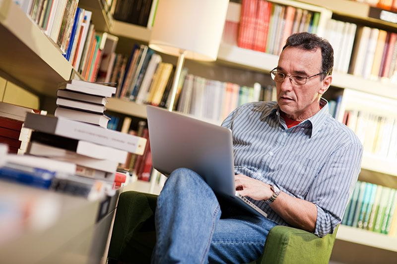 Middle-aged man studying for a degree or certification