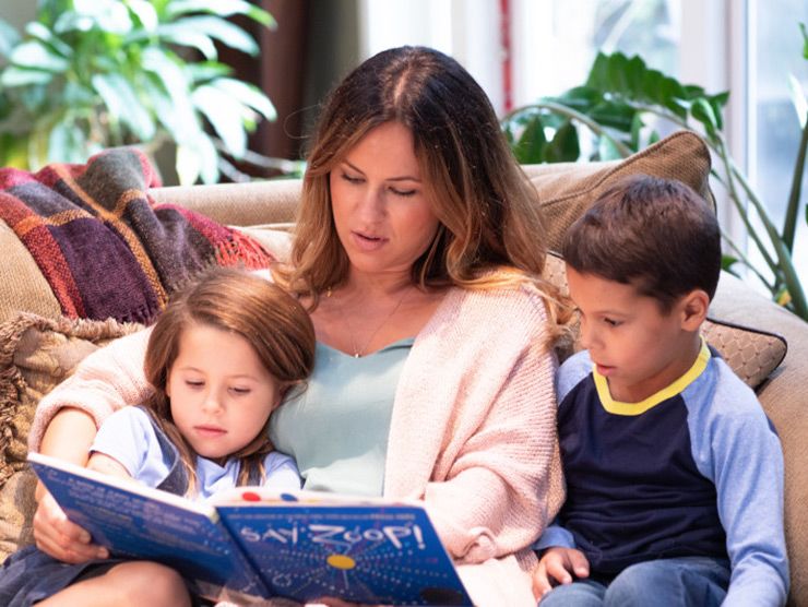 mother reading to her kids and teaching them about race