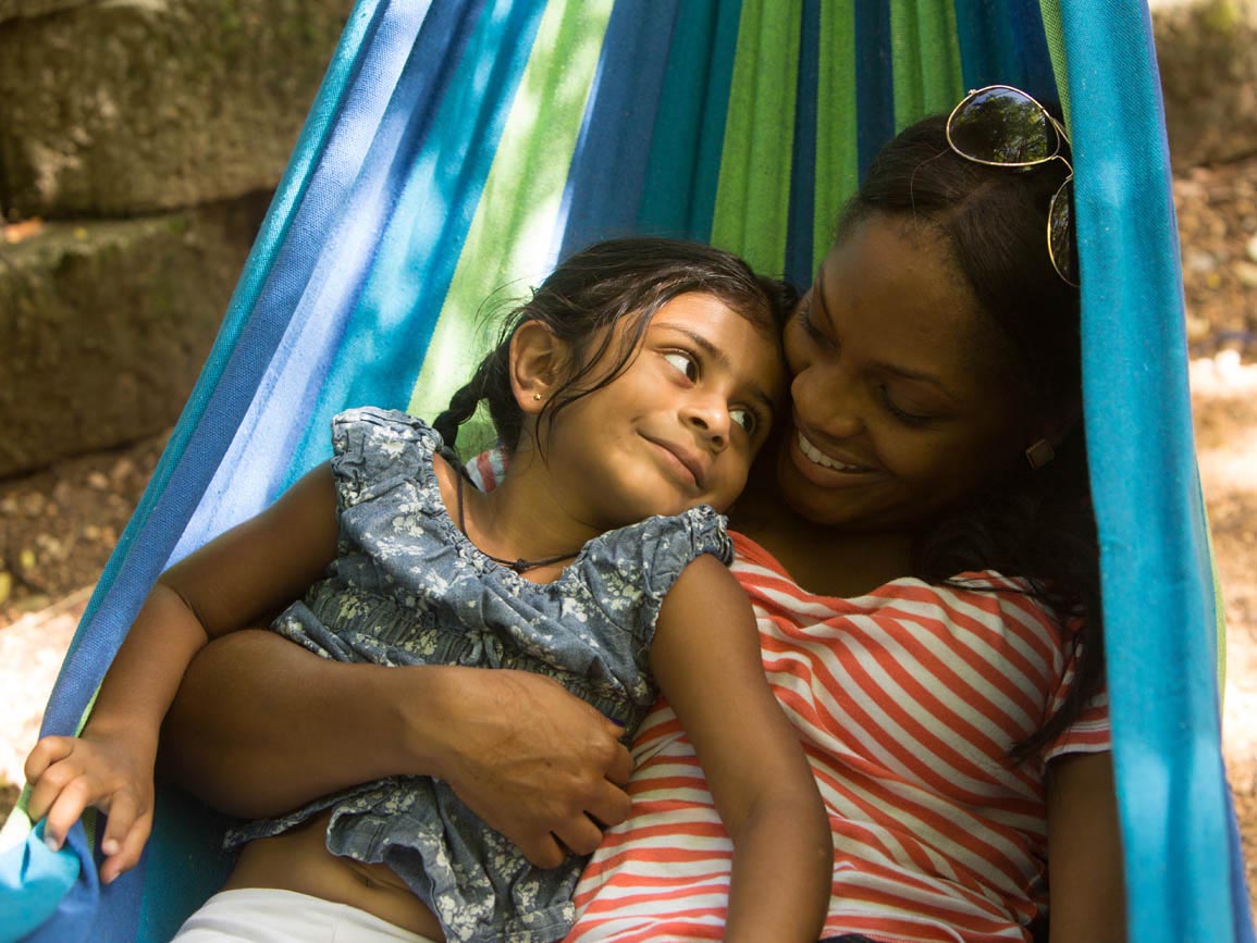 A mother and daughter in a hammock