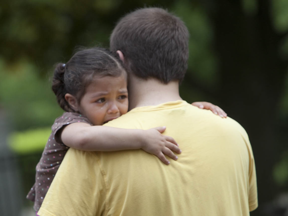 A child hugging her dad