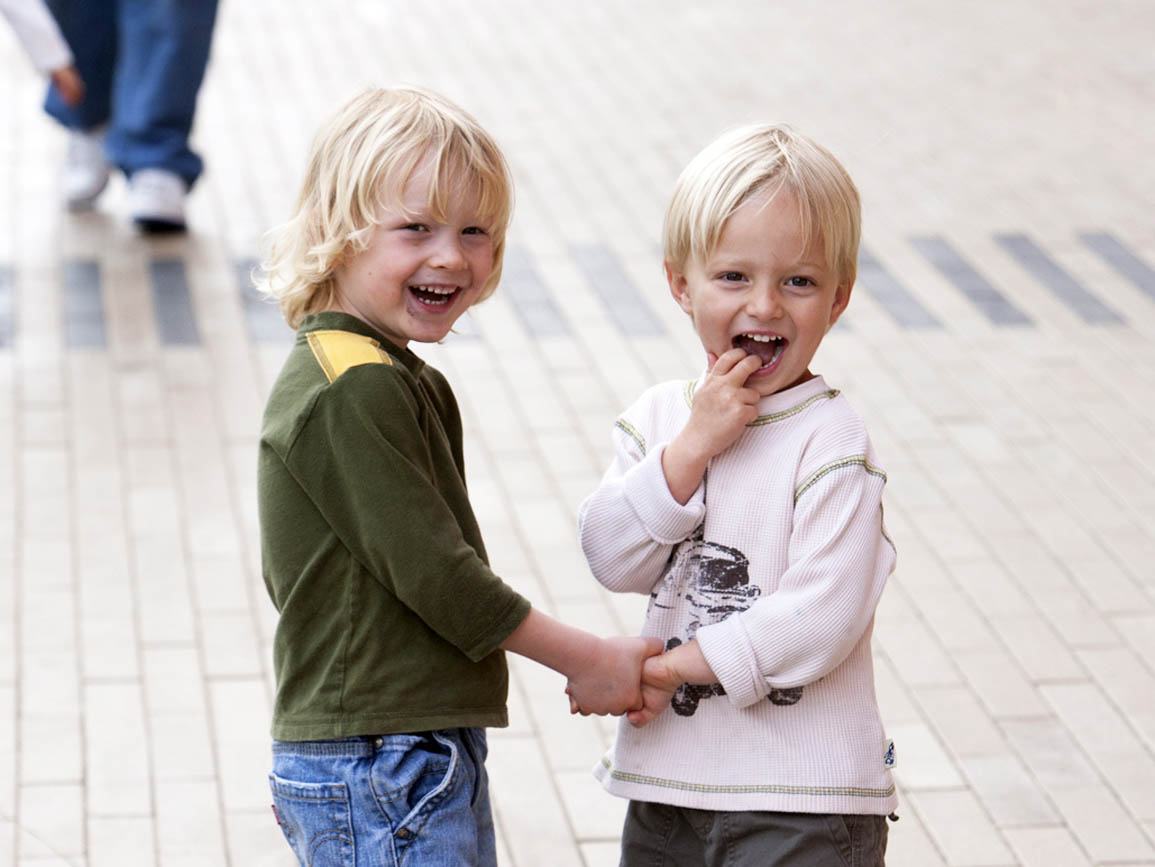 Twins holding hands