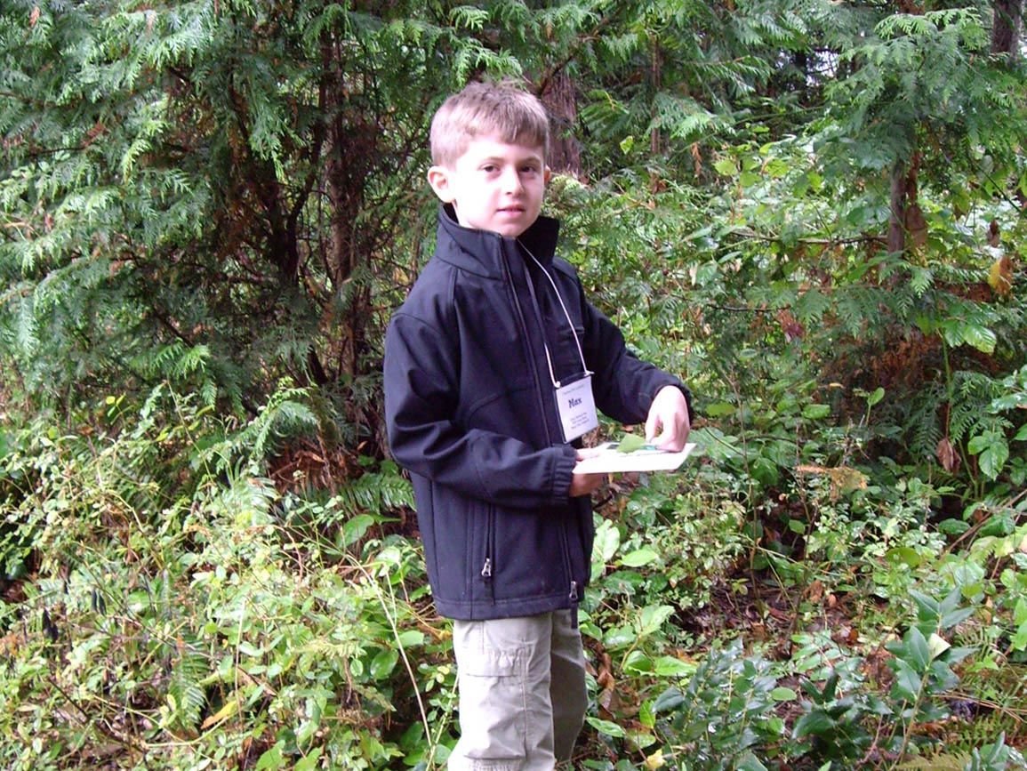Elementary school-aged boy walking a nature trail
