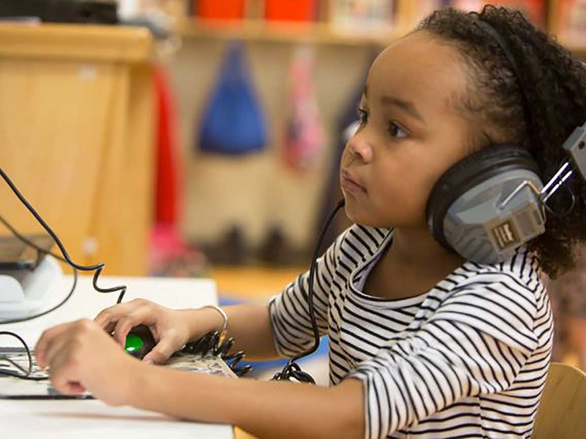 Preschool girl with headphones