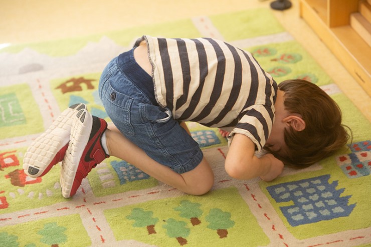 Toddler has his head on the ground at Daycare saying NO!