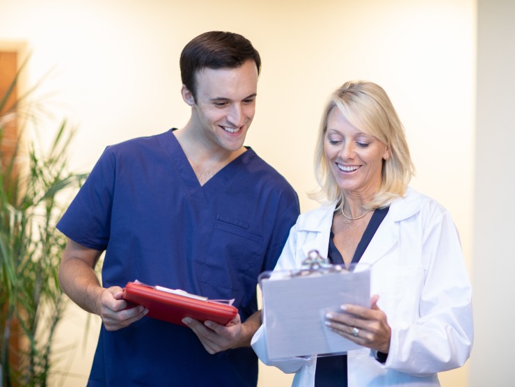 two healthcare workers standing 