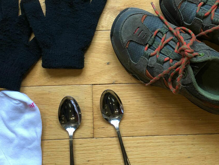 A pair of socks, a pair of shoes, and two spoons for matching game at home