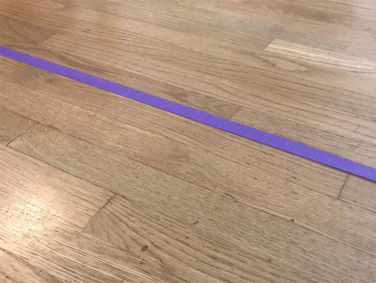 Purple tape on a wooden floor at day care 